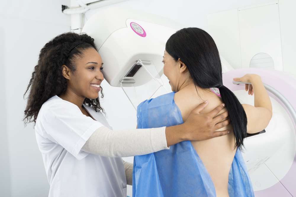 Happy,Doctor,Assisting,Woman,Undergoing,Mammogram,X-ray,Test.