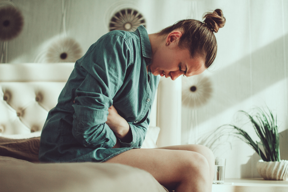 woman experiencing painful menstrual cramps