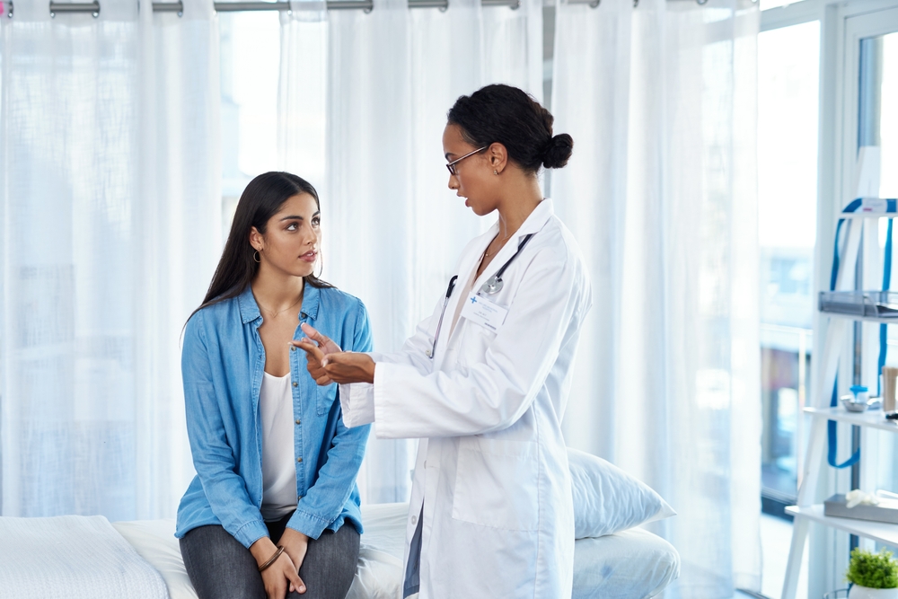 woman talking to doctor.