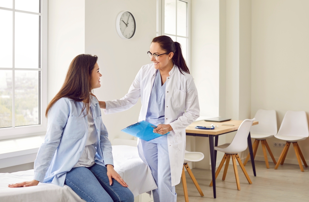 woman talking to doctor.